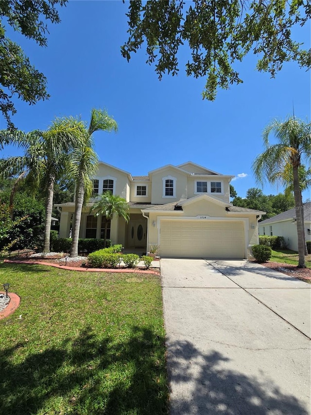 5704 Ansley Way, Mount Dora, FL 32757 - view of front of property featuring stucco siding, concrete driveway, a front yard, and a garage