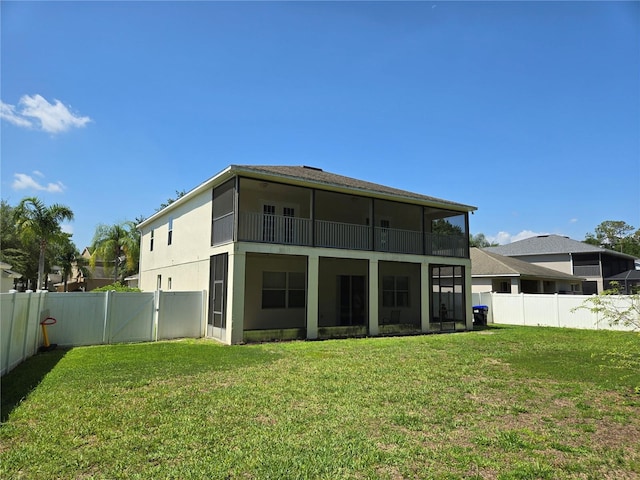 5704 Ansley Way, Mount Dora, FL 32757 - back of property featuring a sunroom, stucco siding, and a gate