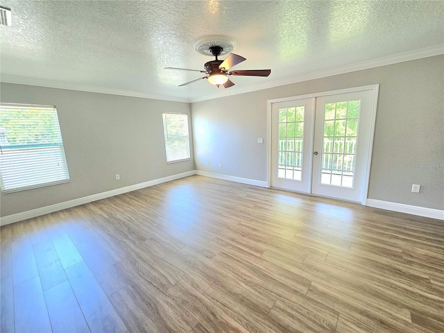 5704 Ansley Way, Mount Dora, FL 32757 - empty room with ornamental molding, a ceiling fan, light wood-type flooring, a textured ceiling, and baseboards