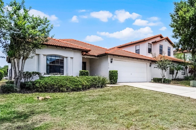 16614 Lazy Breeze Loop, Clermont, FL 34714 - mediterranean / spanish home featuring concrete driveway, stucco siding, a front yard, an attached garage, and a tiled roof