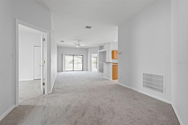 16614 Lazy Breeze Loop, Clermont, FL 34714 - spare room with light carpet, a ceiling fan, and baseboards