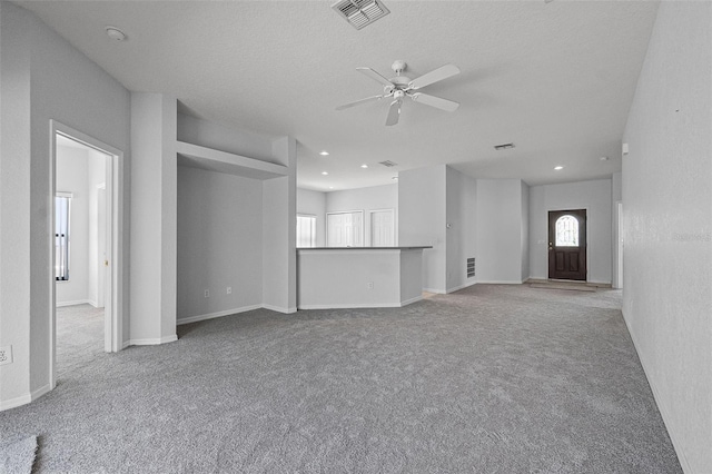 16614 Lazy Breeze Loop, Clermont, FL 34714 - unfurnished living room with carpet, ceiling fan, recessed lighting, and baseboards
