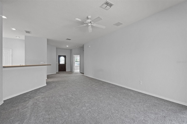 16614 Lazy Breeze Loop, Clermont, FL 34714 - unfurnished living room featuring carpet floors, a ceiling fan, baseboards, and recessed lighting