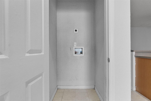16614 Lazy Breeze Loop, Clermont, FL 34714 - laundry area featuring electric dryer hookup, hookup for a washing machine, light tile patterned flooring, and baseboards