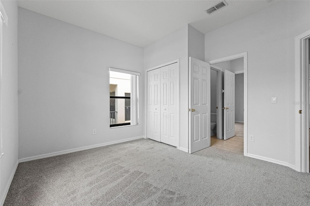 16614 Lazy Breeze Loop, Clermont, FL 34714 - unfurnished bedroom with carpet, baseboards, and a closet