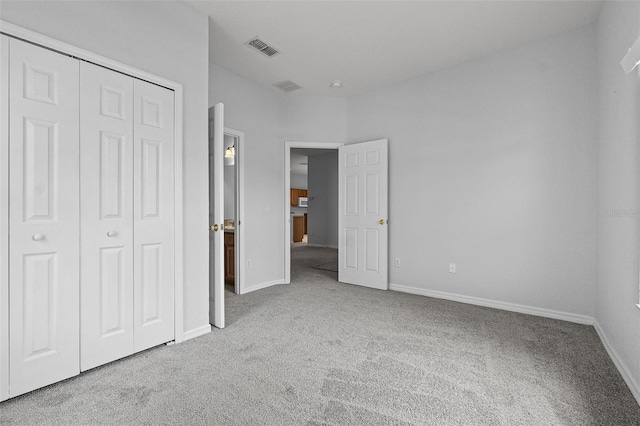 16614 Lazy Breeze Loop, Clermont, FL 34714 - unfurnished bedroom with carpet flooring, a closet, and baseboards