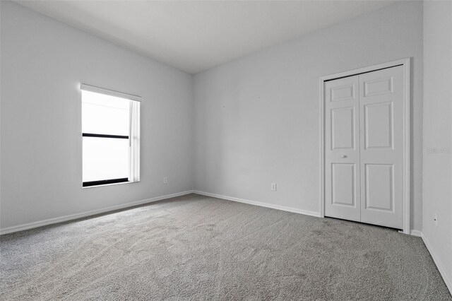 16614 Lazy Breeze Loop, Clermont, FL 34714 - carpeted empty room featuring baseboards
