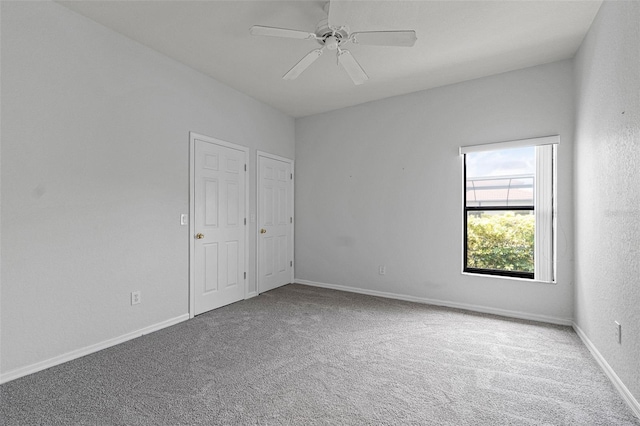 16614 Lazy Breeze Loop, Clermont, FL 34714 - unfurnished bedroom featuring carpet floors, baseboards, and a ceiling fan