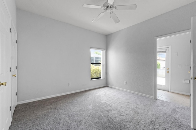 16614 Lazy Breeze Loop, Clermont, FL 34714 - carpeted empty room with ceiling fan, baseboards, and tile patterned floors