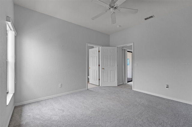 16614 Lazy Breeze Loop, Clermont, FL 34714 - unfurnished bedroom with carpet, baseboards, and a ceiling fan
