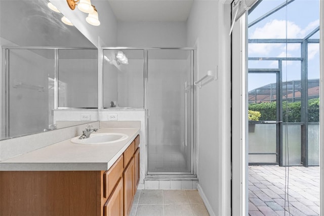 16614 Lazy Breeze Loop, Clermont, FL 34714 - full bath featuring vanity, a shower stall, tile patterned flooring, and baseboards