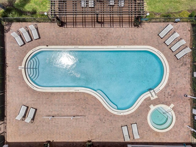 16614 Lazy Breeze Loop, Clermont, FL 34714 - community pool featuring a patio