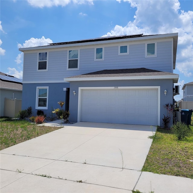 1556 Aspen Ave, Davenport, FL 33837 - traditional home with driveway, stucco siding, and an attached garage