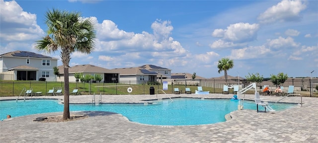 1556 Aspen Ave, Davenport, FL 33837 - community pool with a residential view and a patio area