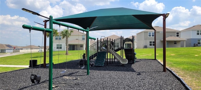 1556 Aspen Ave, Davenport, FL 33837 - community play area featuring a residential view and a lawn