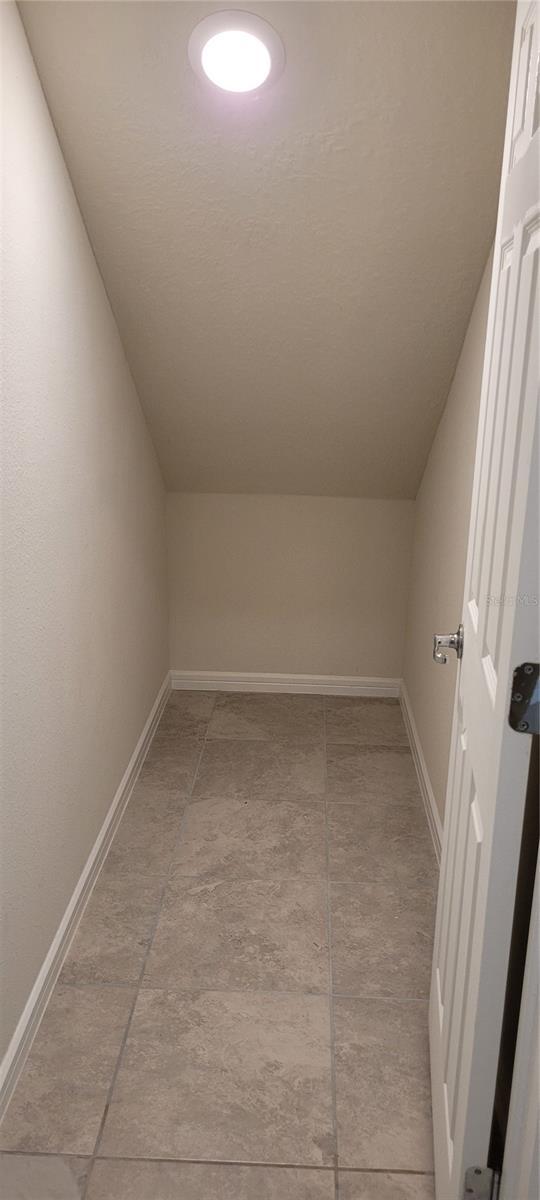 1556 Aspen Ave, Davenport, FL 33837 - bonus room featuring lofted ceiling and baseboards