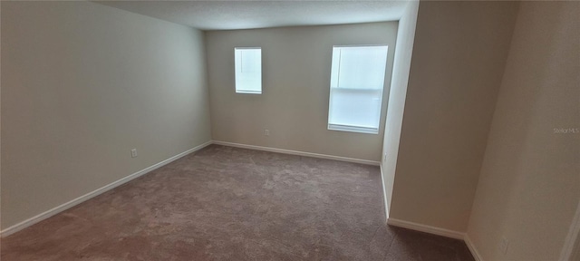 1556 Aspen Ave, Davenport, FL 33837 - carpeted empty room featuring baseboards