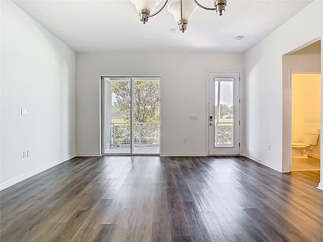 11037 Bagley Aly, Windermere, FL 34786 - spare room with a chandelier, dark wood finished floors, and baseboards