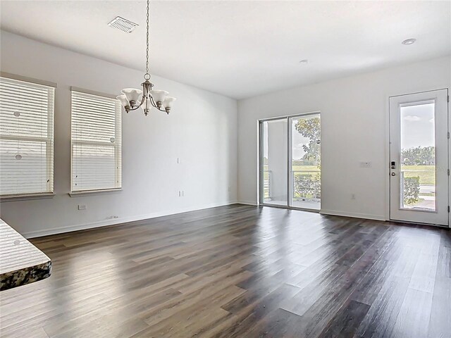 11037 Bagley Aly, Windermere, FL 34786 - unfurnished dining area featuring a chandelier, dark wood finished floors, and baseboards