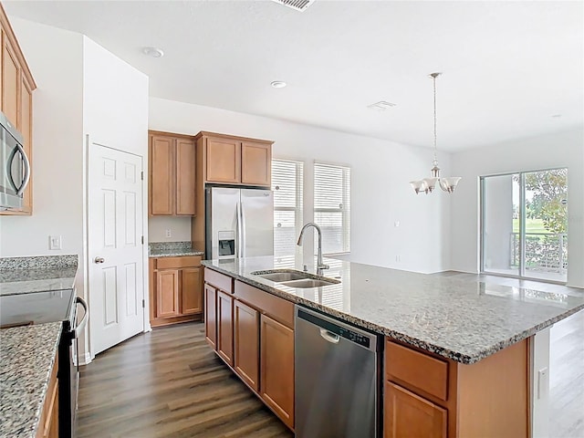 11037 Bagley Aly, Windermere, FL 34786 - kitchen featuring appliances with stainless steel finishes, a sink, dark wood-type flooring, a chandelier, and light stone countertops