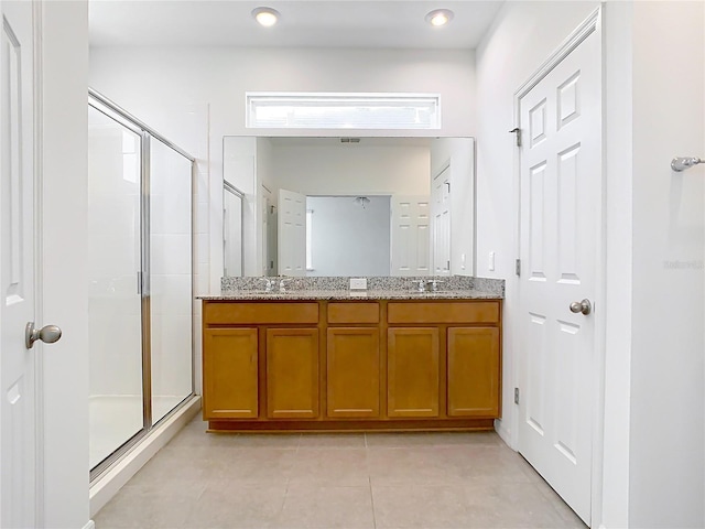 11037 Bagley Aly, Windermere, FL 34786 - bathroom featuring a shower stall, double vanity, and tile patterned flooring