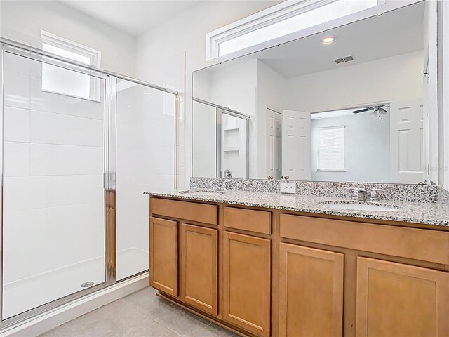 11037 Bagley Aly, Windermere, FL 34786 - bathroom featuring a stall shower, double vanity, and tile patterned flooring