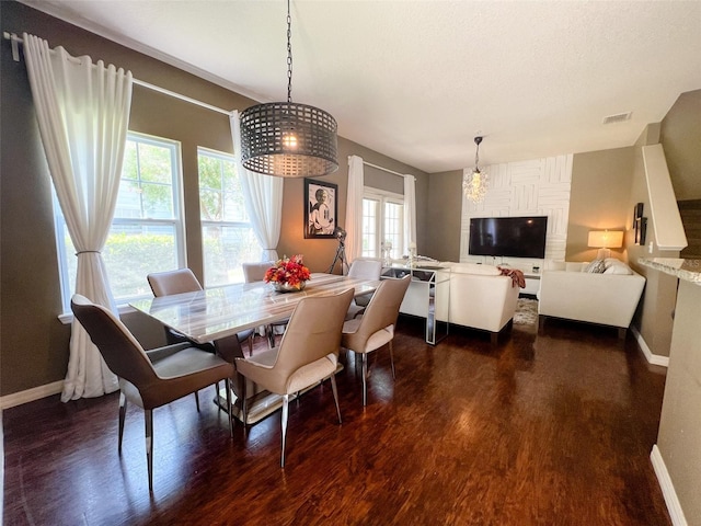 5356 Diplomat Ct Unit 108, Kissimmee, FL 34746 - dining room with baseboards and dark wood finished floors