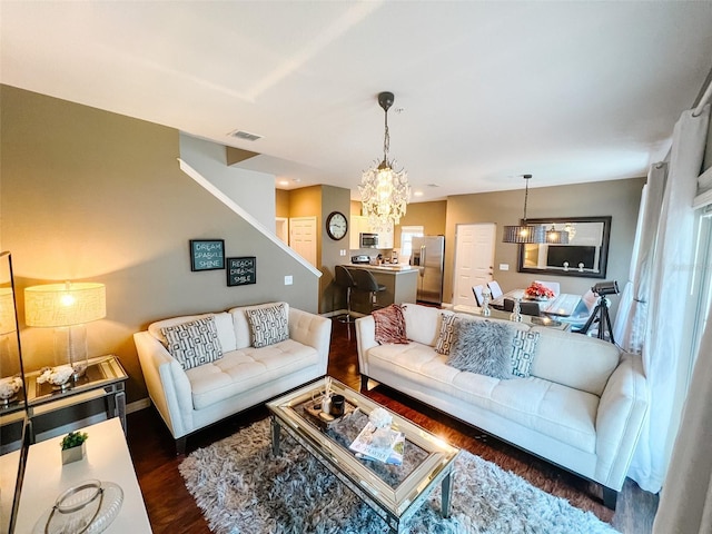 5356 Diplomat Ct Unit 108, Kissimmee, FL 34746 - living area featuring a chandelier, wood finished floors, stairs, and baseboards