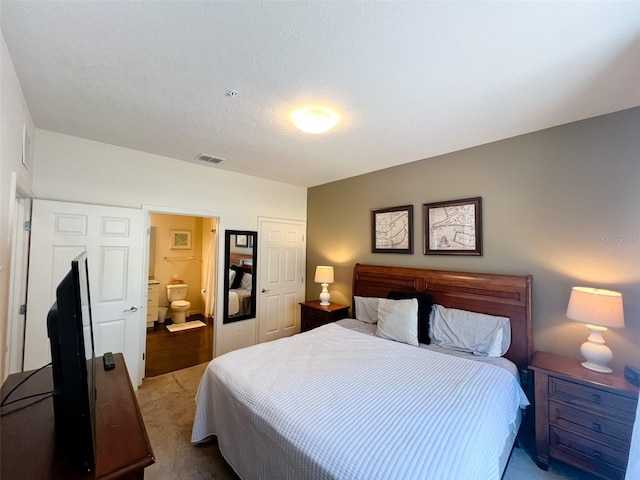 5356 Diplomat Ct Unit 108, Kissimmee, FL 34746 - bedroom featuring carpet floors and ensuite bathroom