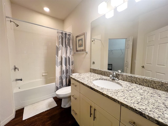 5356 Diplomat Ct Unit 108, Kissimmee, FL 34746 - bathroom with wood finished floors, shower / tub combo, vanity, toilet, and a spacious closet