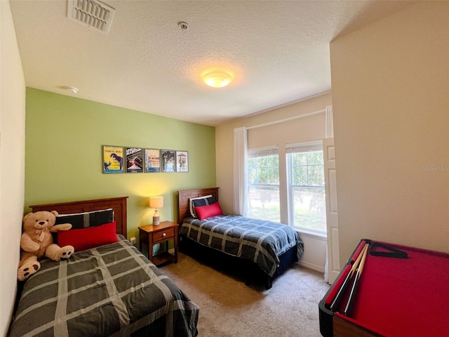 5356 Diplomat Ct Unit 108, Kissimmee, FL 34746 - carpeted bedroom featuring a textured ceiling