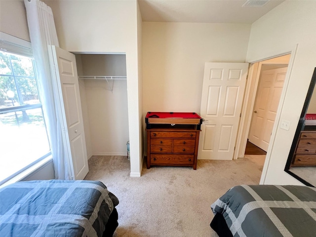 5356 Diplomat Ct Unit 108, Kissimmee, FL 34746 - bedroom with light carpet and a closet