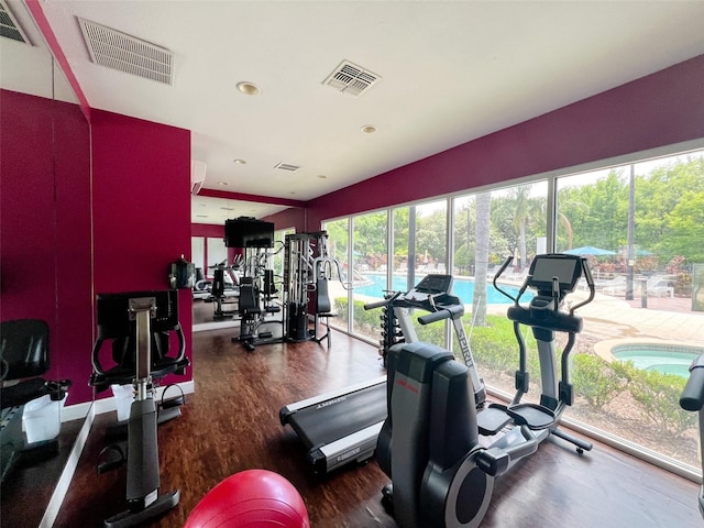 5356 Diplomat Ct Unit 108, Kissimmee, FL 34746 - exercise room with wood finished floors and recessed lighting