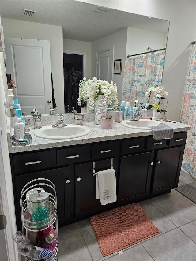 6315 Hillview Rd, Spring Hill, FL 34606 - full bathroom featuring double vanity and tile patterned flooring