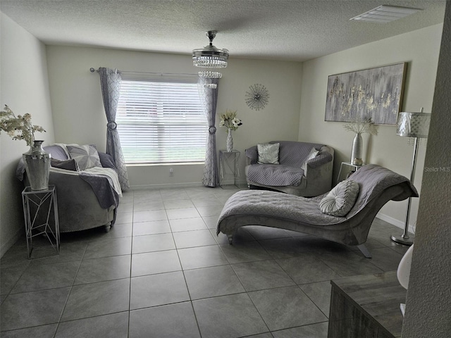 6315 Hillview Rd, Spring Hill, FL 34606 - tiled living room featuring a textured ceiling and baseboards