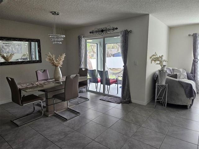 6315 Hillview Rd, Spring Hill, FL 34606 - dining room with a textured ceiling, baseboards, and tile patterned floors