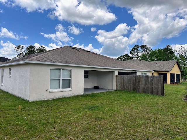 19 Rainbow Ln, Palm Coast, FL 32164 - rear view of house featuring a patio area, stucco siding, and a shingled roof