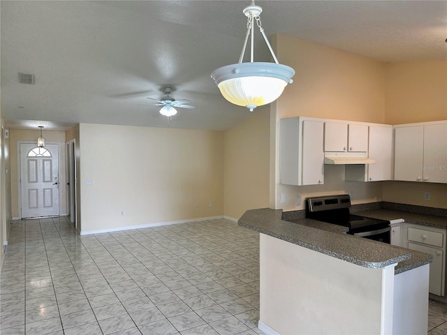 19 Rainbow Ln, Palm Coast, FL 32164 - kitchen featuring stainless steel electric range oven, dark countertops, under cabinet range hood, a ceiling fan, and hanging light fixtures