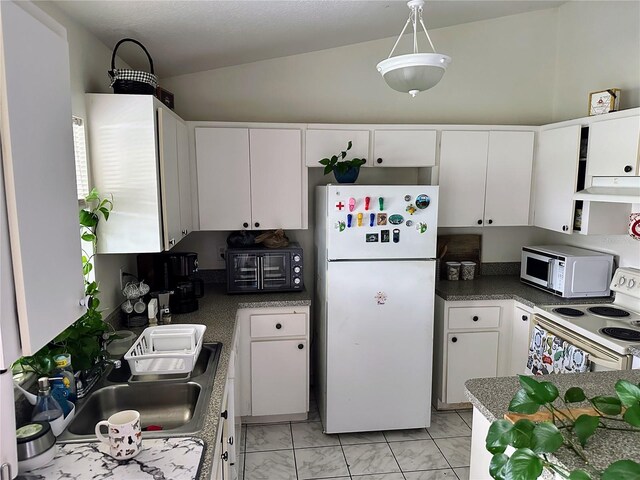 19 Rainbow Ln, Palm Coast, FL 32164 - kitchen with white appliances, white cabinets, vaulted ceiling, light marble finish floors, and a sink