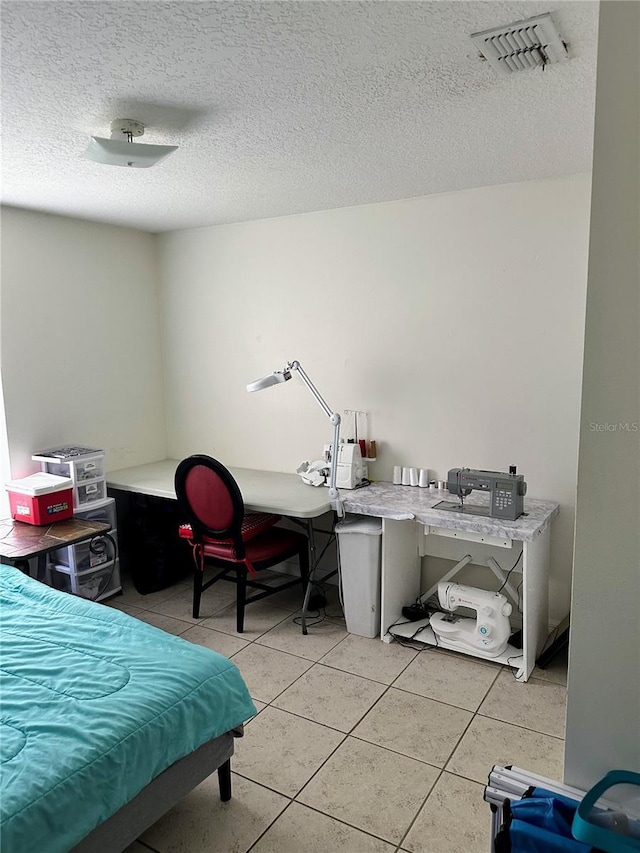 19 Rainbow Ln, Palm Coast, FL 32164 - bedroom featuring light tile patterned floors and a textured ceiling