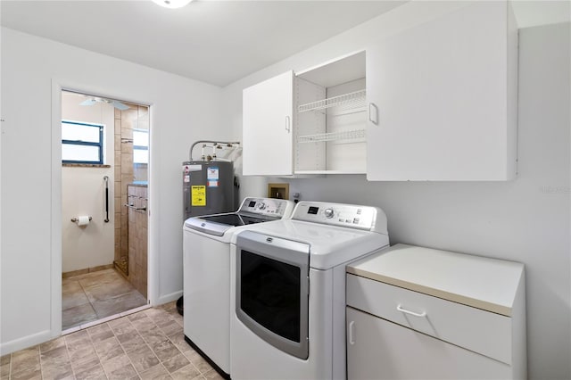 2740 Barker Rd, Saint Cloud, FL 34771 - laundry room with independent washer and dryer, cabinet space, and water heater