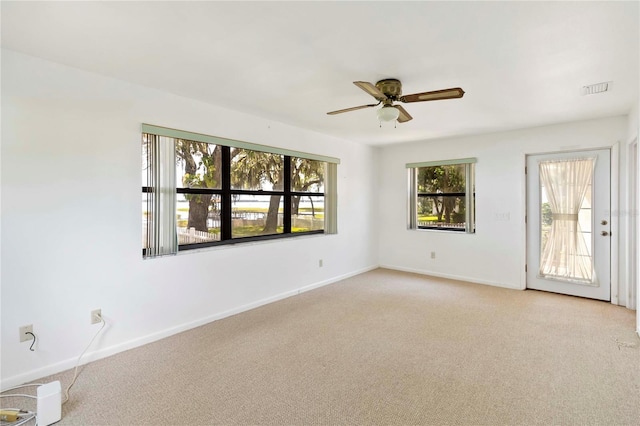 2740 Barker Rd, Saint Cloud, FL 34771 - unfurnished room with light carpet and a ceiling fan