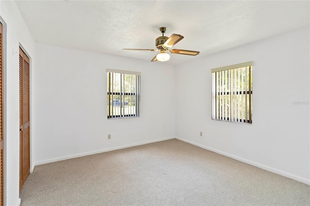2740 Barker Rd, Saint Cloud, FL 34771 - unfurnished bedroom featuring carpet floors, a closet, and ceiling fan