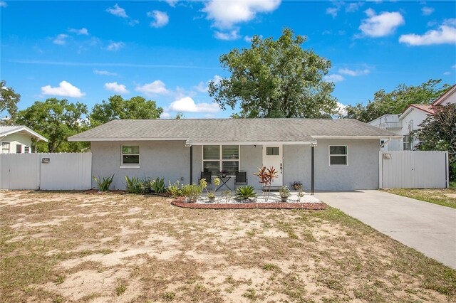 416 E Seminole Ave, Lake Wales, FL 33853 - ranch-style house with a gate, stucco siding, and a porch