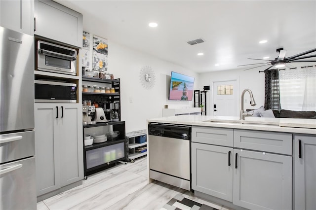 416 E Seminole Ave, Lake Wales, FL 33853 - kitchen featuring stainless steel appliances, gray cabinets, a sink, recessed lighting, and light countertops