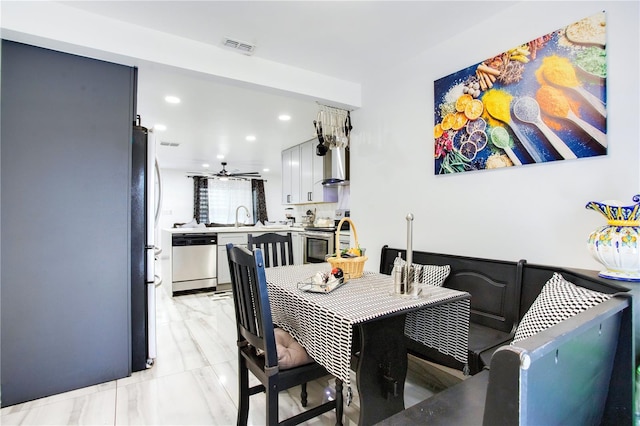 416 E Seminole Ave, Lake Wales, FL 33853 - dining room with recessed lighting and light marble finish floors