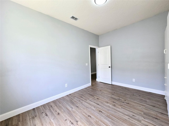 2312 Twickingham Ct, Clermont, FL 34711 - empty room featuring wood finished floors and baseboards