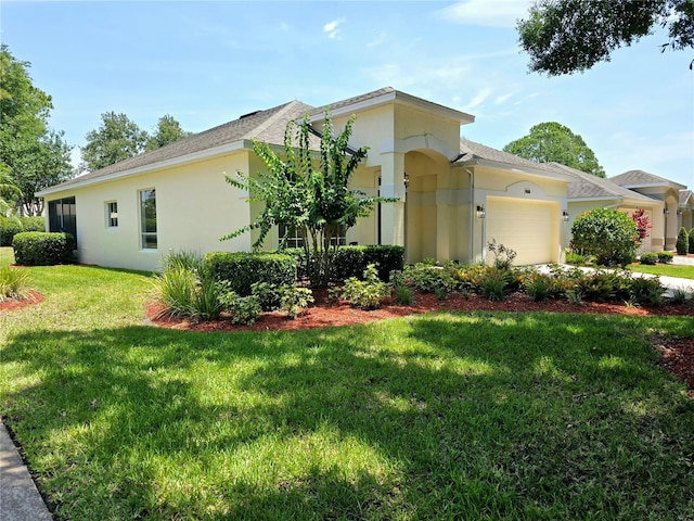2312 Twickingham Ct, Clermont, FL 34711 - view of front of house featuring an attached garage, stucco siding, a front yard, and a shingled roof