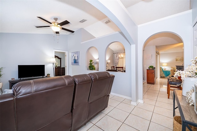 812 Adour Dr, Kissimmee, FL 34759 - living area with ceiling fan, light tile patterned flooring, vaulted ceiling, and arched walkways