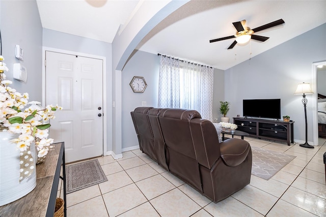 812 Adour Dr, Kissimmee, FL 34759 - living room featuring lofted ceiling, ceiling fan, arched walkways, and light tile patterned floors